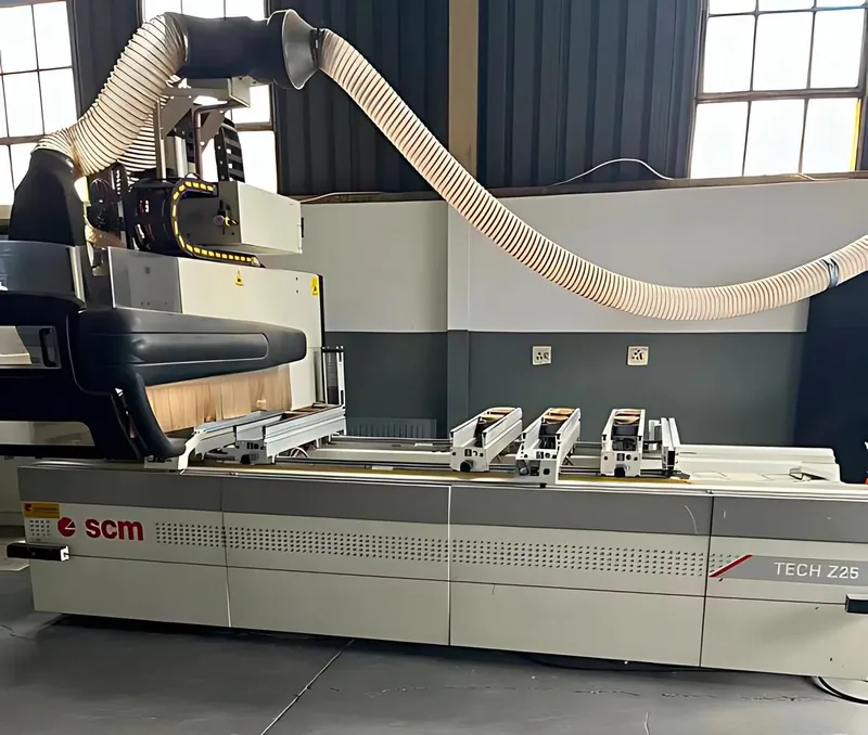 The CNC machining centre drilling hinge and shelf holes at the FKC Kitchens workshop.